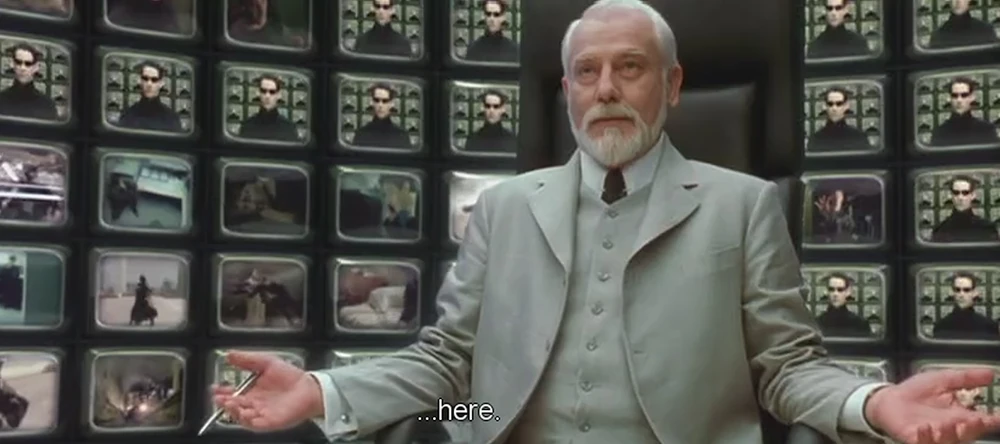 Neo (Christ Consciousness in its body of representation) and Buddhist Nirmanakaya meets The Architect (the deterministic demiurge, the creator of the machines)