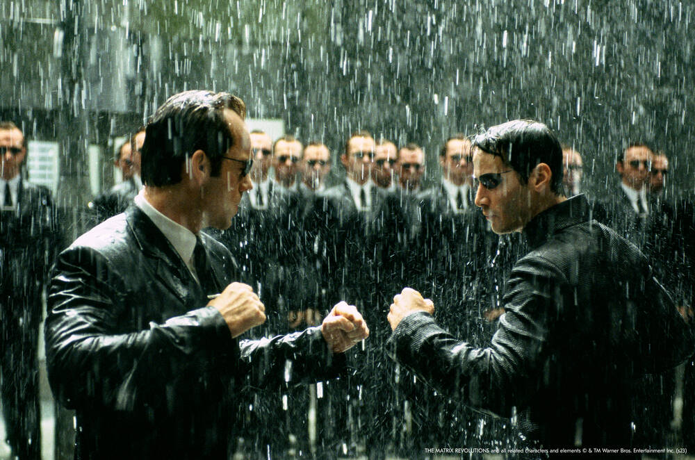 Neo (the One, the Monad), fights the self-replicating agents Smith